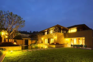 Landscaping lighting with a beautiful house and green lawn